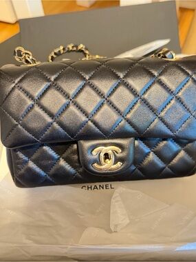 CHANEL Black Quilted Mini Flap Bag with Gold Hardware